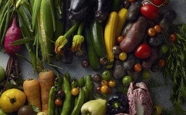 Fresh produce including chillies, tomatoes and vegetables arranged at Aman Tokyo.