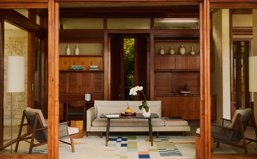 Hill Casita lounge at Amanera resort, Dominican Republic, with wooden cabinetry and seated areas.