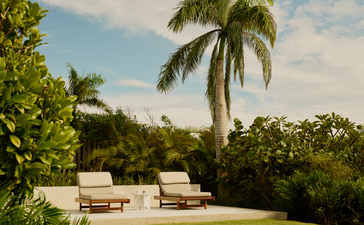Hill Casita terrace with loungers overlooking tropical gardens at Amanera resort, Dominican Republic.
