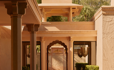 Pool pavilion exterior at Amanbagh with sandstone architecture and water feature.