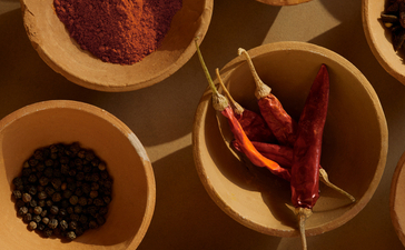 Bowls of Indian spices and seasonings at Amanbagh, arranged overhead.