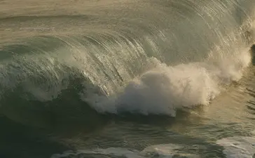 Powerful wave breaking onto the shore at Amanera resort, Dominican Republic.