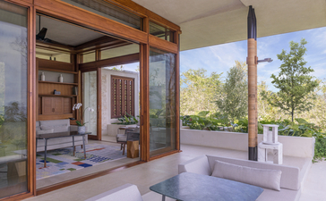 Hill Casita at Amanera with open wooden doors revealing a spa bath and shelving, overlooking verdant landscape.