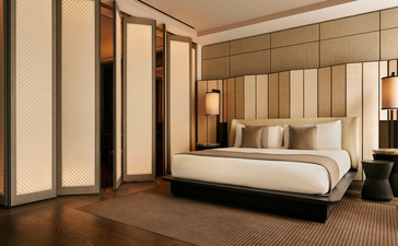 Chambre avec lit king-size et portes coulissantes, Aman New York.
