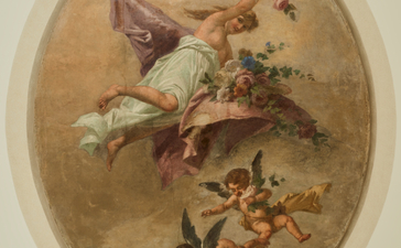 アマン ヴェニスのコッキーナス・アパートメントの寝室に飾られた、鳥と花が描かれたフレスコ画アートワーク。