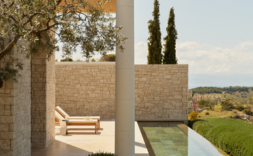 Deluxe pool pavilion at Amanzoe overlooking the Peloponnese landscape, with plunge pool and terrace seating.