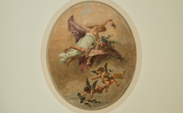 Fresco detail of a bird perched on flowering branches in Coccina's Apartment bedroom at Aman Venice.