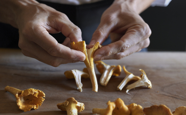 Chef's hands shaping fresh pasta at Aman Venice cooking class.