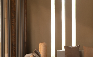 Spa treatment area at Amanyangyun with stone massage bed and vertical light panels.