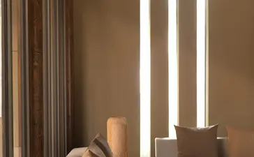 Spa treatment area at Amanyangyun with stone massage bed and vertical light panels.