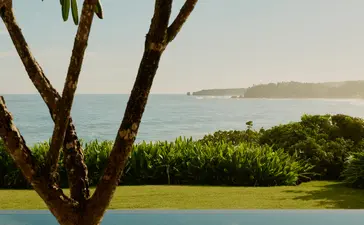 Casita at Amanera resort with plunge pool framed by tropical foliage and coastal views.