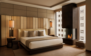 Camera da letto della Grand Suite all'Aman New York, con letto matrimoniale e arredi eleganti.