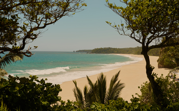 Two-bedroom Casa at Amanera with views across sandy beach and turquoise sea.