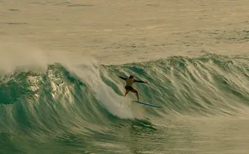 Surfer riding a wave at Amanera, Dominican Republic.