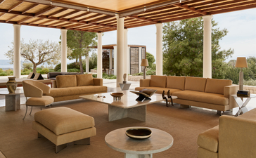 Villa living area at Amanzoe with open-sided pavilion overlooking gardens and countryside.