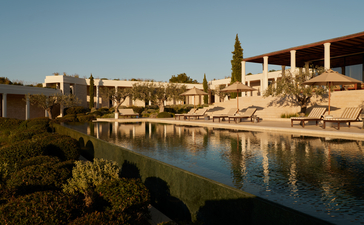 Villa with views towards the waterfront and classical ruins at Amanzoe.