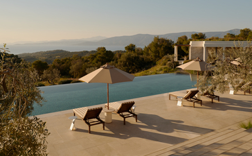 Villa plunge pool overlooking olive groves at Amanzoe, Greece.
