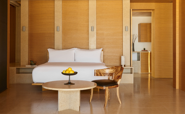 Cabana bedroom at Amanzoe with neutral tones, minimal furnishings and serene ambiance.