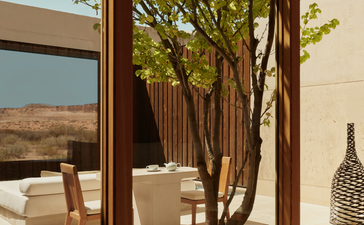 Desert pool suite with shaded terrace and native trees at Amangiri, USA.