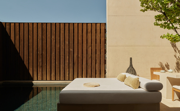 Mesa Pool Suite bed at Amangiri resort, overlooking desert landscape and plunge pool.