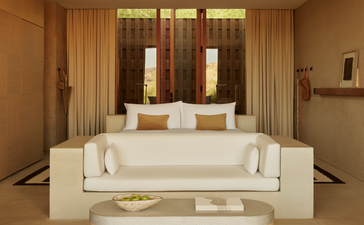 Mesa Suite bedroom at Amangiri resort, with cream bed and warm earth tones.