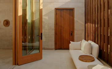 Mesa Suite bathroom with wooden partition and vessel sink at Amangiri resort.