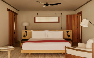Sarika accommodation pavilion bedroom at Amangiri with wooden furnishings and minimal décor.