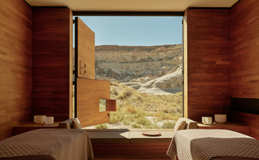 Wellness massage room at Amangiri with open door framing desert landscape view.