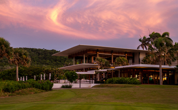Amanera resort accommodation at dusk, with warm pink sky and manicured gardens.
