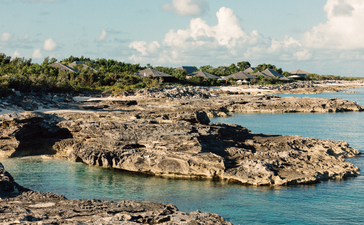 Turquoise waters and rocky shoreline at Amanyara, Turks and Caicos.