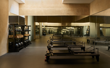 Amangiri's spa and gym facility with exercise equipment and warm-toned interior lighting.