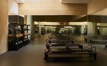 Amangiri's spa and gym facility with exercise equipment and warm-toned interior lighting.