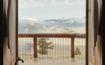 Grand Teton Suite bathroom window opening onto mountain views at Amangani.