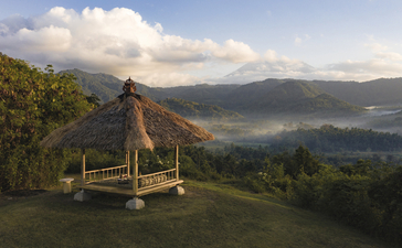 Wooden pavilion overlooking verdant Balinese valley at Amankila resort, Manggis, Bali.