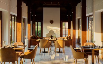 Amanruya's sushi restaurant with wooden tables, warm lighting, and minimalist décor.