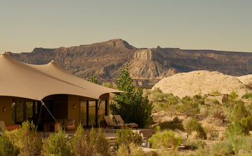 Canvas structures at Amangiri with views towards surrounding canyon landscape at sunrise.