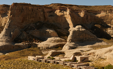 Aerial view of Amangiri's pavilions nestled within a dramatic desert canyon landscape.