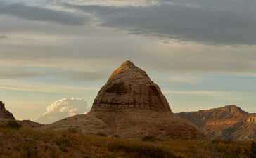 Distinctive rock formation rising from desert landscape at Amangiri, Utah.