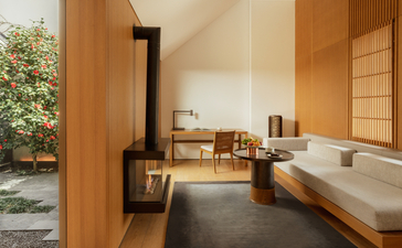 Ming Deluxe Pavilion landscape lounge at Amanyangyun, with wooden interiors, soaking tub and garden views.