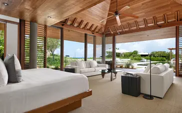 Principal bedroom with wooden ceiling and ocean views, Amanyara resort, Turks and Caicos.