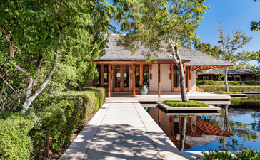 Five-bedroom beach sala villa with wooden walkway and reflection pond at Amanyara, Turks and Caicos.