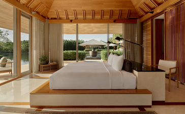Four-bedroom villa principal bedroom at Amanyara, Turks and Caicos, with ocean views and contemporary furnishings.