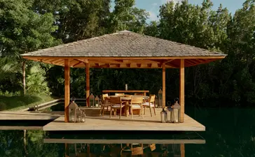 Pavilhão ao ar livre com estrutura de madeira na Amanyara, resort em Turks e Caicos, cercado por vegetação tropical.