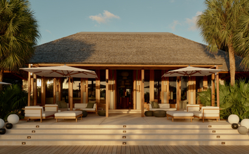 Four-bedroom villa with thatched roof and wooden columns at Amanyara, Turks and Caicos.