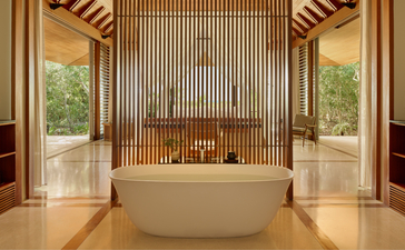 Ocean Cove Pavilion bathtub at Amanyara, Turks and Caicos, with wooden slat walls and ocean views.