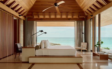 Principal bedroom with wooden ceiling and ocean views at Amanyara, Turks and Caicos.