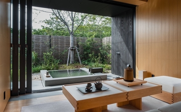 Tsuki Villa's private onsen overlooking a Japanese garden at Amanemu resort.