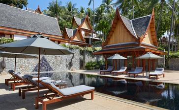Seven-bedroom garden villa at Amanpuri with teak pavilions and plunge pool surrounded by tropical grounds.