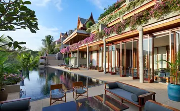 Seven-bedroom ocean villa with swimming pool at Amanpuri, featuring traditional architecture overlooking tranquil waters.