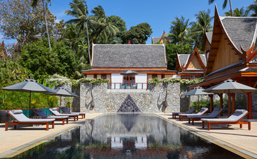 Seven-bedroom garden villa terrace with reflecting pool and traditional Thai architecture at Amanpuri.